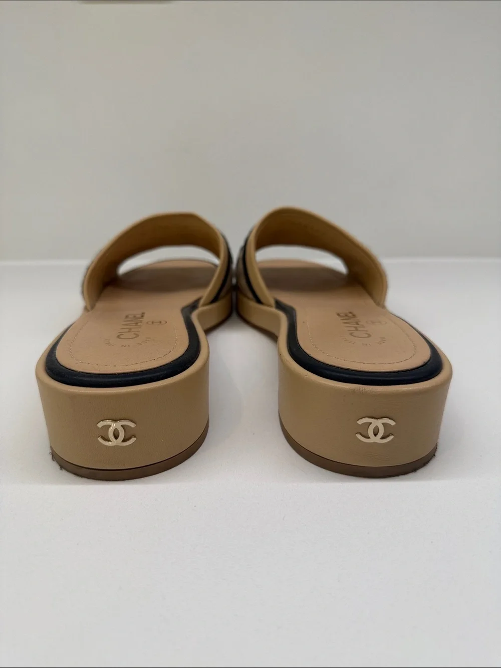 CHANEL Tan and Black Quilted Logo Slide Mules